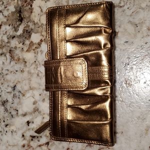 Gold fossil wallet